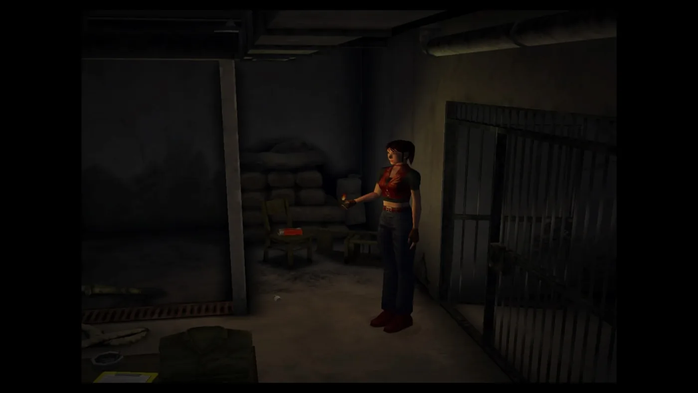 Claire Redfield exploring a dark prison room in an official PlayStation Store screenshot